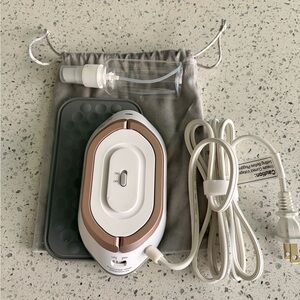 BNWOT Small handheld travel iron + mist bottle